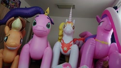 Size: 2048x1152 | Tagged: safe, applejack, daybreaker, pipp petals, princess cadance, alicorn, earth pony, pegasus, pony, g4, g5, inflatable toy, irl, nightmare fuel, photo