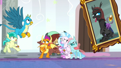 Size: 1280x719 | Tagged: safe, screencap, gallus, mirage (g4), ocellus, sandbar, silverstream, smolder, yona, changedling, changeling, classical hippogriff, dragon, earth pony, griffon, hippogriff, pony, yak, a matter of principals, g4, cloven hooves, colored hooves, eyes closed, flying, picture frame, scared, spread wings, student six, wings