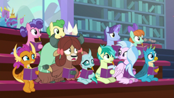 Size: 1277x720 | Tagged: safe, screencap, berry blend, berry bliss, gallus, huckleberry, november rain, ocellus, peppermint goldylinks, sandbar, silverstream, smolder, yona, changedling, changeling, classical hippogriff, dragon, earth pony, griffon, hippogriff, pegasus, pony, unicorn, yak, g4, the end in friend, bow, cloven hooves, colored hooves, friendship student, hair bow, monkey swings, mouth hold, notebook, pencil, raised eyebrow, student six