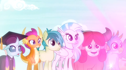 Size: 1600x898 | Tagged: safe, screencap, gallus, ocellus, sandbar, silverstream, smolder, yona, changedling, changeling, classical hippogriff, dragon, earth pony, griffon, hippogriff, pony, yak, g4, uprooted, bow, clothes, dragoness, female, glowing, graduation cap, hair bow, hat, jewelry, male, monkey swings, necklace, raised eyebrow, robe, student six