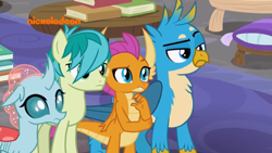 Size: 1249x702 | Tagged: safe, screencap, gallus, ocellus, sandbar, smolder, changedling, changeling, dragon, earth pony, griffon, pony, g4, what lies beneath, book, gallus is not amused, group, hair over one eye, logo, nickelodeon, pillow, quartet, raised eyebrow, table, unamused