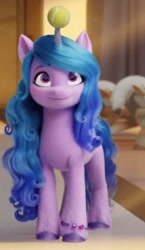 Size: 496x856 | Tagged: safe, screencap, izzy moonbow, pony, unicorn, g5, my little pony: a new generation, spoiler:my little pony: a new generation, ball, cropped, female, horn, horn impalement, hornball, izzy impaling things, izzy's tennis ball, mare, solo, tennis ball
