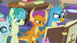 Size: 1249x702 | Tagged: safe, screencap, gallus, ocellus, sandbar, silverstream, smolder, changedling, changeling, classical hippogriff, dragon, earth pony, griffon, hippogriff, pony, g4, what lies beneath, book, logo, nickelodeon, offscreen character, pillow, raised eyebrow, table
