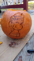 Size: 828x1472 | Tagged: safe, artist:starrscout-23, izzy moonbow, pony, unicorn, g5, female, halloween, holiday, irl, jack-o-lantern, looking at you, mare, one eye closed, outdoors, photo, pumpkin, solo, wink, winking at you