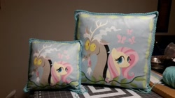 Size: 1500x844 | Tagged: safe, artist:coreyscorner, discord, fluttershy, butterfly, discordant harmony, g4, duo, duo male and female, female, male, pillow, product, selling