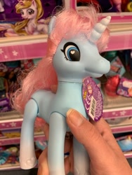 Size: 400x533 | Tagged: safe, human, pony, unicorn, bootleg, female, hand, irl, irl human, mare, photo, shelf, solo, tinsel, zuru sparkle girlz