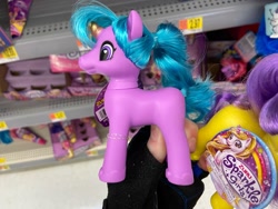 Size: 1280x960 | Tagged: safe, human, pony, bootleg, colored horn, female, hand, horn, incorrect hair placement, irl, irl human, mare, photo, ponytail, shelf, toy, zuru sparkle girlz