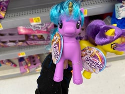 Size: 1280x960 | Tagged: safe, human, pony, unicorn, bootleg, colored horn, female, front view, horn, incorrect hair placement, irl, irl human, looking at you, mare, photo, shelf, toy, zuru sparkle girlz