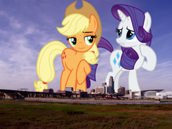 Size: 1600x1200 | Tagged: safe, anonymous editor, artist:cloudy glow, edit, applejack, rarity, earth pony, pony, unicorn, g4, cowboy hat, duo, female, giant pony, giantess, hat, highrise ponies, irl, macro, mare, nebraska, omaha, photo, ponies in real life, raised hoof, stetson, story included