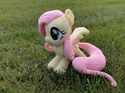 Size: 3671x2753 | Tagged: safe, artist:natsnaps, fluttershy, pegasus, pony, g4, grass, grass field, high res, irl, outdoors, photo, plushie, solo
