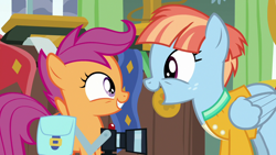 Size: 1280x720 | Tagged: safe, screencap, scootaloo, windy whistles, pegasus, pony, g4, parental glideance, bag, camera, cute, cutealoo, female, filly, foal, freckles, grin, looking at each other, looking at someone, mare, open mouth, open smile, saddle bag, smiling, smiling at each other, windybetes