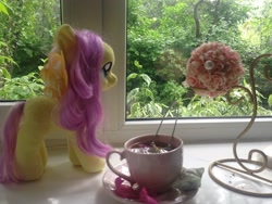 Size: 3264x2448 | Tagged: safe, artist:hysteriana, fluttershy, pegasus, pony, g4, aesthetics, blank flank, cup, flower, high res, irl, looking at something, nature, petals, photo, plushie, summer, tea, teacup, toy, window