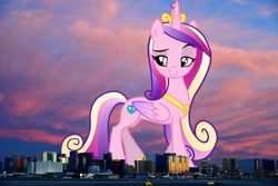 Size: 1524x1016 | Tagged: safe, artist:rustle-rose, edit, editor:jaredking779, princess cadance, alicorn, pony, g4, attack on pony, colored wings, crown, eyebrows, female, folded wings, giant pony, giantess, highrise ponies, hoof shoes, irl, jewelry, las vegas, lidded eyes, looking at you, macro, mare, multicolored hair, multicolored tail, multicolored wings, nevada, peytral, photo, ponies in real life, raised eyebrow, raised leg, red eyes, regalia, smiling, smirk, solo, tail, wings