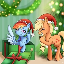 Size: 1800x1800 | Tagged: safe, artist:galaxy swirl, applejack, rainbow dash, earth pony, pegasus, pony, g4, christmas, christmas tree, duo, duo female, eyes closed, female, hat, holiday, indoors, laughing, lesbian, mare, present, santa hat, ship:appledash, shipping, spread wings, tree, wings