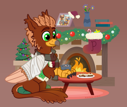 Size: 1600x1350 | Tagged: safe, artist:pink-pone, oc, oc only, oc:pavlos, griffon, broken bone, broken wing, cast, chocolate, christmas, christmas stocking, christmas tree, clothes, colored wings, cookie, eared griffon, fireplace, folded wings, food, griffon oc, happy, holiday, hot chocolate, injured, male, photo, simple background, sitting, sling, smiling, solo, sweater, tree, wing fluff, wings