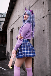 Size: 2871x4306 | Tagged: safe, artist:hysteriana, izzy moonbow, human, g5, arms, blue hair, brony, choker, clothes, cosplay, costume, cute, fake ears, female, festival, high res, irl, irl human, legs, looking at you, makeup, nail polish, nails, outdoors, photo, rear view, schoolgirl, skirt, socks, solo, stockings, sweater, thigh highs