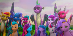 Size: 2388x1185 | Tagged: safe, screencap, blaize skysong, fountain (g5), hitch trailblazer, izzy moonbow, jade (g5), lava (g5), luxxe, misty brightdawn, pipp petals, sparky sparkeroni, spike, zipp storm, dragon, earth pony, pegasus, pony, unicorn, g5, my little pony: make your mark, my little pony: make your mark chapter 6, roots of all evil, spoiler:g5, spoiler:my little pony: make your mark, dragon lord spike, eyes closed, female, group shot, happy, male, mare, older, older spike, rebirth misty, smiling, stallion, winged spike, wings