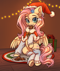 Size: 3800x4500 | Tagged: safe, artist:konejo, fluttershy, pegasus, pony, g4, absurd resolution, christmas, christmas lights, clothes, commission, cookie, cute, daaaaaaaaaaaw, ear fluff, eyebrows, female, food, hair accessory, hat, holiday, indoors, leg warmers, looking at you, mare, mouth hold, partially open wings, pelerine, present, raised hoof, santa hat, shyabetes, sitting, smiling, smiling at you, solo, underhoof, wings