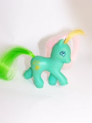 Size: 768x1024 | Tagged: safe, photographer:kisscurl, dreamer, earth pony, pony, g2, foal, irl, photo, raised hoof, toy