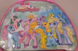 Size: 2560x1671 | Tagged: safe, earth pony, pony, bag, bootleg, female, filly, foal, irl, mare, not applejack, not blue belle, open mouth, open smile, photo, princess pony myths, rearing, smiling