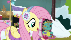 Size: 1920x1080 | Tagged: safe, edit, edited screencap, screencap, sound edit, applejack, fluttershy, holly the hearths warmer doll, earth pony, pegasus, pony, g4, my little pony best gift ever, animated, applejack's hat, clothes, cowboy hat, dalek, doctor who, doll, duo, exterminate, female, hat, hoof hold, i love being an expensive toy, jumper, mare, mouth hold, pull string, scarf, sound, this ended in death, toy, webm, winter outfit