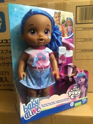 Size: 1500x2000 | Tagged: safe, izzy moonbow, human, pony, unicorn, g5, official, baby alive, dark skin, irl, merchandise, photo, toy