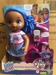 Size: 1500x2000 | Tagged: safe, izzy moonbow, human, pony, unicorn, g5, official, baby alive, dark skin, irl, merchandise, photo, toy