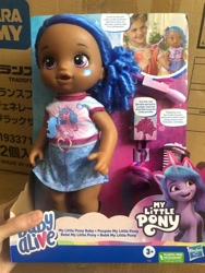 Size: 1500x2000 | Tagged: safe, izzy moonbow, human, pony, unicorn, g5, official, baby, baby alive, comments locked down, dark skin, doll, duckery in the comments, irl, merchandise, photo, target demographic, toy