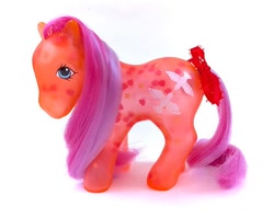 Size: 570x453 | Tagged: safe, brightglow, earth pony, pony, g1, bow, brushable, female, glow 'n show ponies, irl, mare, merchandise, photo, simple background, solo, tail, tail bow, toy, translucent, white background