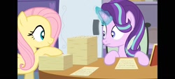 Size: 1600x720 | Tagged: safe, artist:agrol, screencap, fluttershy, starlight glimmer, pegasus, pony, unicorn, g4, element of kindness, female, glowing, glowing horn, horn, looking at each other, looking at someone, paper, paperwork, quill, school of friendship, the element of kindness
