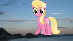 Size: 2047x1149 | Tagged: safe, anonymous editor, artist:dashiesparkle edit, edit, lily, lily valley, earth pony, pony, g4, background pony, brazil, female, flower, flower in hair, giant pony, giantess, highrise ponies, irl, lily (flower), looking at you, macro, mare, photo, ponies in real life, rio de janeiro, smiling, solo