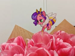 Size: 2936x2185 | Tagged: safe, artist:jewellier, photographer:jewellier, pipp petals, bee, bee pony, bumblebee, hybrid, original species, pony, g5, antennae, bouquet, bumblebipp, chest fluff, chibi, featured image, female, flower, high res, insect wings, irl, paper child, photo, pipp is short, pipp is smol, ponies in real life, smol, solo, species swap, this will end in pollination, tiny, tiny ponies, traditional art, tulip, wings