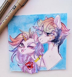 Size: 1014x1080 | Tagged: safe, artist:dorry, oc, oc only, pony, unicorn, :p, blue background, choker, coffee, duo, golden horn, horn, magic, magic aura, one eye closed, pen, photo, sideburns, simple background, tongue out, traditional art, unicorn oc, watercolor painting