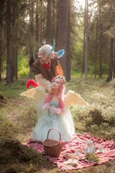 Size: 736x1104 | Tagged: safe, artist:kreakray, discord, fluttershy, human, g4, basket, clothes, cosplay, costume, food, forest, grapes, irl, irl human, looking at each other, looking at someone, photo, picnic, picnic basket, picnic blanket