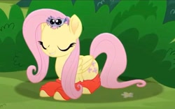 Size: 2160x1344 | Tagged: safe, screencap, fluttershy, pegasus, pony, spider, g4, my little pony: rainbow roadtrip, big eyes, bush, clothes, cropped, cute, eyes closed, female, flower, folded wings, happy, hope hollow, lying down, mare, prone, socks, wings