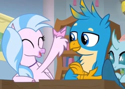 Size: 2160x1550 | Tagged: safe, screencap, gallus, ocellus, silverstream, changeling, classical hippogriff, griffon, hippogriff, a rockhoof and a hard place, g4, bookshelf, classroom, cute, desk, excited, eyes closed, female, happy, male, school