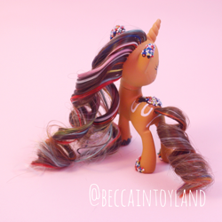 Size: 2048x2048 | Tagged: safe, artist:beccaintoyland, oc, oc:sprinkled donut, pony, unicorn, g4, g4.5, body markings, brown mane, butt, colored hooves, curly mane, curly tail, customized toy, donut, facing away, food, high res, irl, multicolored mane, photo, pink mane, plot, red mane, solo, sprinkles, tail, toy
