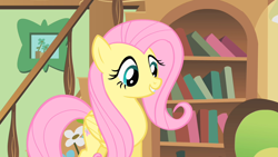 Size: 1280x720 | Tagged: safe, screencap, fluttershy, pegasus, pony, a bird in the hoof, g4, season 1, book, bookshelf, cute, female, folded wings, mare, picture frame, railing, shyabetes, smiling, solo, staircase, stairs, wings