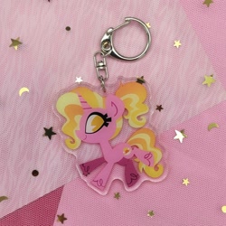 Size: 2048x2049 | Tagged: safe, artist:spacekitsch, luster dawn, pony, unicorn, g4, cute, female, high res, irl, keychain, lusterbetes, mare, merchandise, photo, selling, solo, sparkles, unshorn fetlocks
