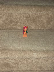 Size: 3024x4032 | Tagged: safe, sunny starscout, earth pony, pony, g5, bag, carpet, carpeted stairs, female, irl, mare, photo, photo from a distance, smol, smolscout, solo, stairs, sunny's bag, toy