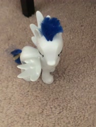 Size: 4032x3024 | Tagged: safe, soarin', pegasus, pony, g4, angry, bed leg, carpet, cute, front view, hair accessory, hairpin, irl, kind of bird's eye perspective, male, photo, soarinbetes, solo, spread wings, stallion, story included, toy, wings