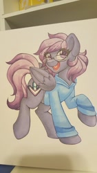 Size: 1152x2048 | Tagged: safe, artist:inkkeystudios, oc, oc only, oc:stutter steps, pegasus, pony, badge, clothes, eye clipping through hair, glasses, hoodie, looking at you, open mouth, open smile, photo, smiling, solo, traditional art