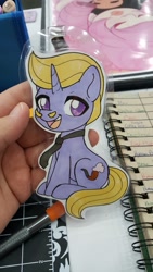 Size: 1152x2048 | Tagged: safe, artist:inkkeystudios, oc, oc only, pony, unicorn, badge, chibi, facial hair, jewelry, looking at you, moustache, necklace, open mouth, open smile, photo, sitting, smiling, solo, traditional art