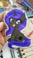 Size: 1152x2048 | Tagged: safe, artist:inkkeystudios, oc, oc only, pony, unicorn, badge, looking at you, open mouth, open smile, photo, sitting, smiling, solo, traditional art