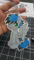 Size: 1152x2048 | Tagged: safe, artist:inkkeystudios, oc, oc only, pegasus, pony, badge, eye clipping through hair, looking at you, open mouth, open smile, photo, sitting, smiling, solo, spread wings, traditional art, wings