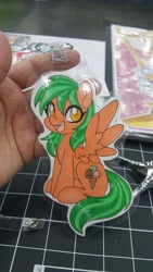 Size: 1152x2048 | Tagged: safe, artist:inkkeystudios, oc, oc only, pegasus, pony, badge, eye clipping through hair, open mouth, open smile, photo, smiling, solo, spread wings, traditional art, wings