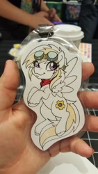 Size: 1152x2048 | Tagged: safe, artist:inkkeystudios, oc, oc only, oc:wing nut, pegasus, pony, :3, badge, eye clipping through hair, flying, goggles, goggles on head, looking at you, neckerchief, photo, smiling, traditional art, unshorn fetlocks