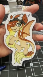 Size: 1152x2048 | Tagged: safe, artist:inkkeystudios, oc, oc only, dracony, dragon, hybrid, badge, goggles, goggles on head, looking at you, photo, solo, spread wings, traditional art, wings