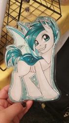 Size: 1152x2048 | Tagged: safe, artist:inkkeystudios, oc, oc only, changeling, pony, badge, fangs, grin, photo, smiling, solo, spread wings, traditional art, wings