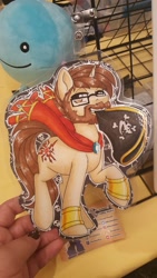 Size: 1152x2048 | Tagged: safe, artist:inkkeystudios, oc, oc only, pony, unicorn, badge, bracer, cape, clothes, facial hair, glasses, goatee, hat, lidded eyes, looking at you, mouth hold, photo, pirate, pirate hat, solo, traditional art